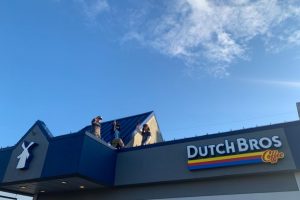 Christmas Lights being installed on Dutch Bros