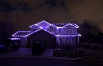 purple lighting on two story house